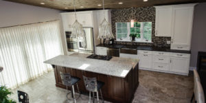 Kitchen with brown cabinets and center island from amiano and son