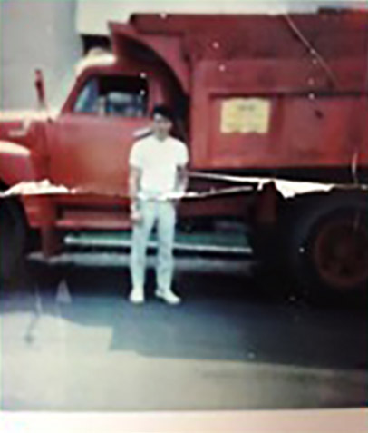 Person standing in front of a red truck