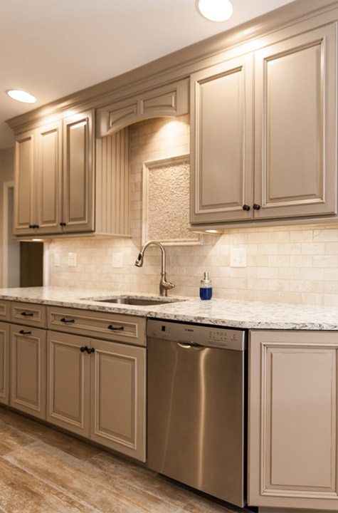 Kitchen with tan cabinets from amiano and son