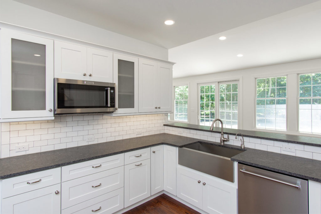 New Kitchen remodel with white cabinets and center island from amiano and son