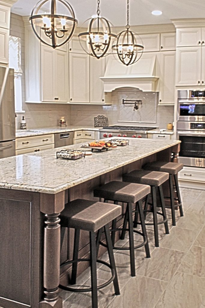 Kitchen with center island and white cabinets from amiano and son