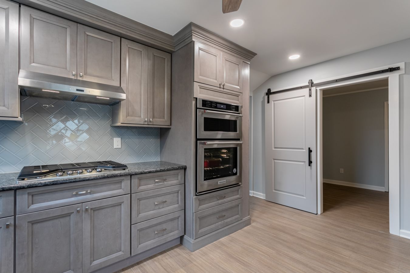 Kitchen with center island and gray cabinets from amiano and son