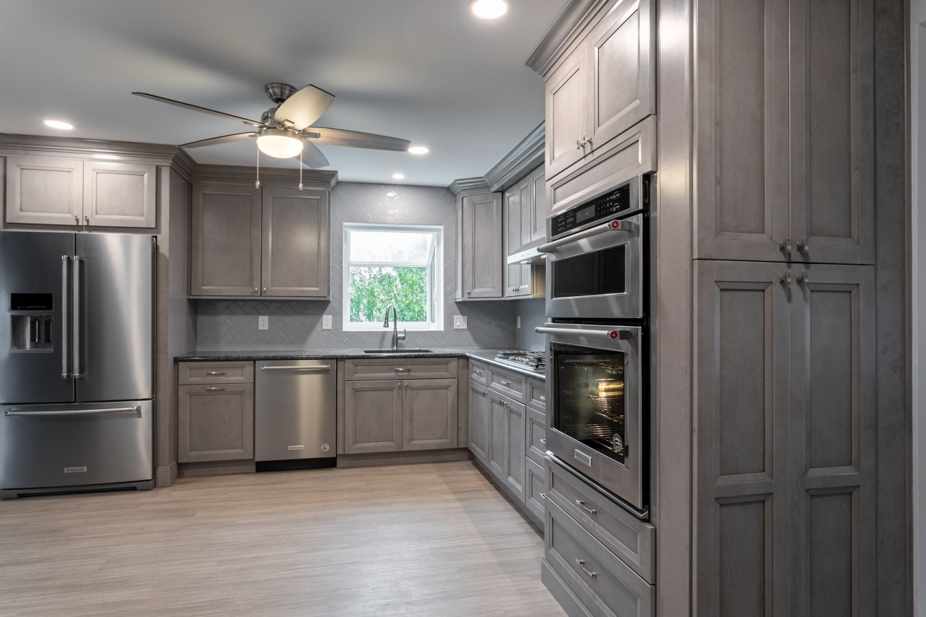 Kitchen with center island and gray cabinets from amiano and son