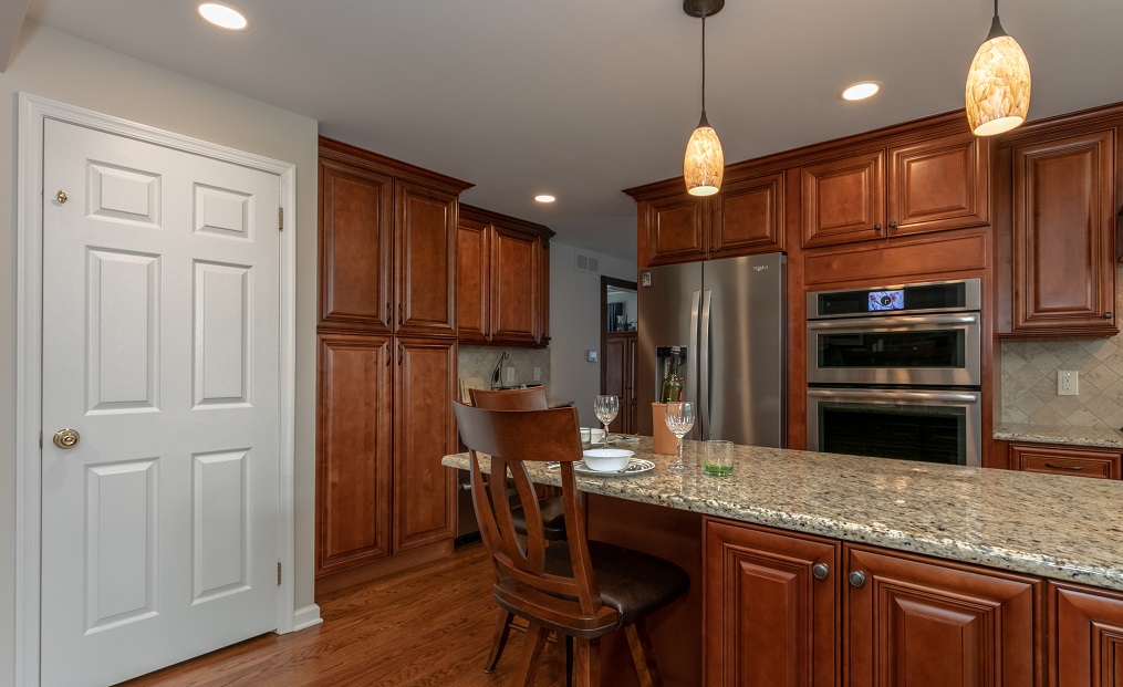 Kitchen with brown cabinets and center island