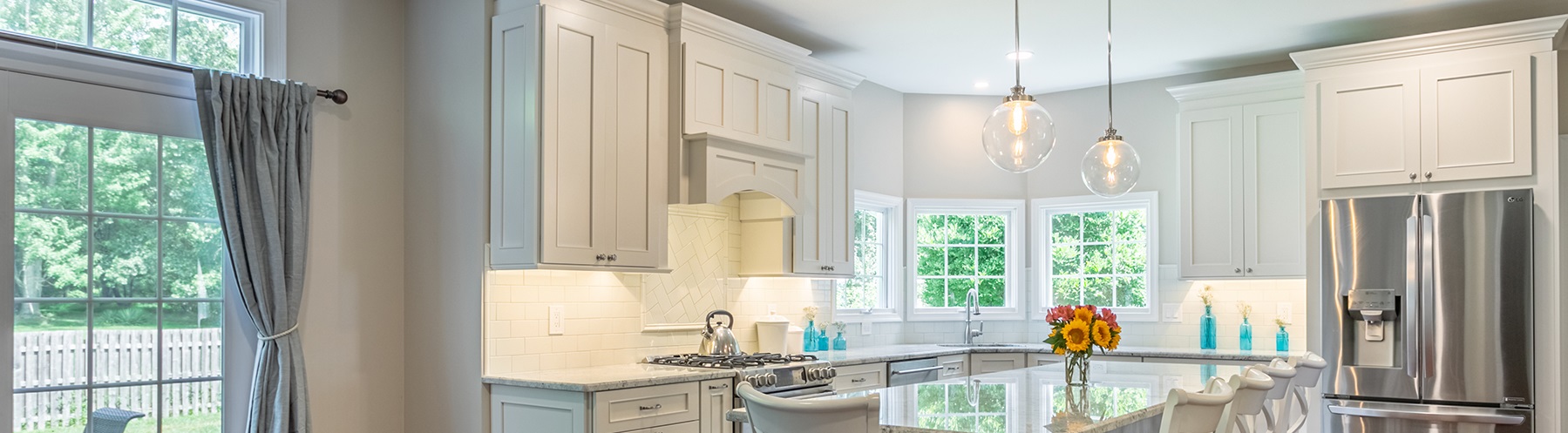 Kitchen with white cabinets from amiano and son
