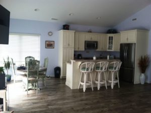 Kitchen with white cabinets and center island