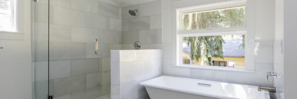 Full bathroom with separate tub and shower in an amiano and son remodel