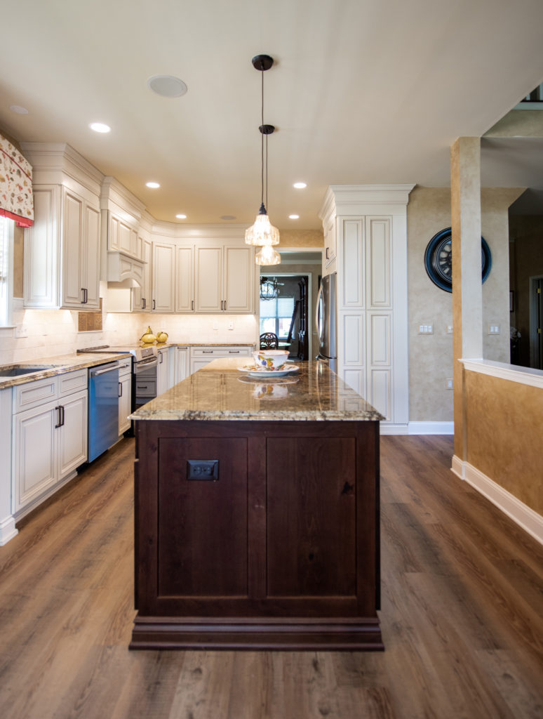 Kitchen with white cabinets and center island from Amiano and son