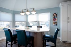 Renovated kitchen with white cabinets and dining room from Amiano and son