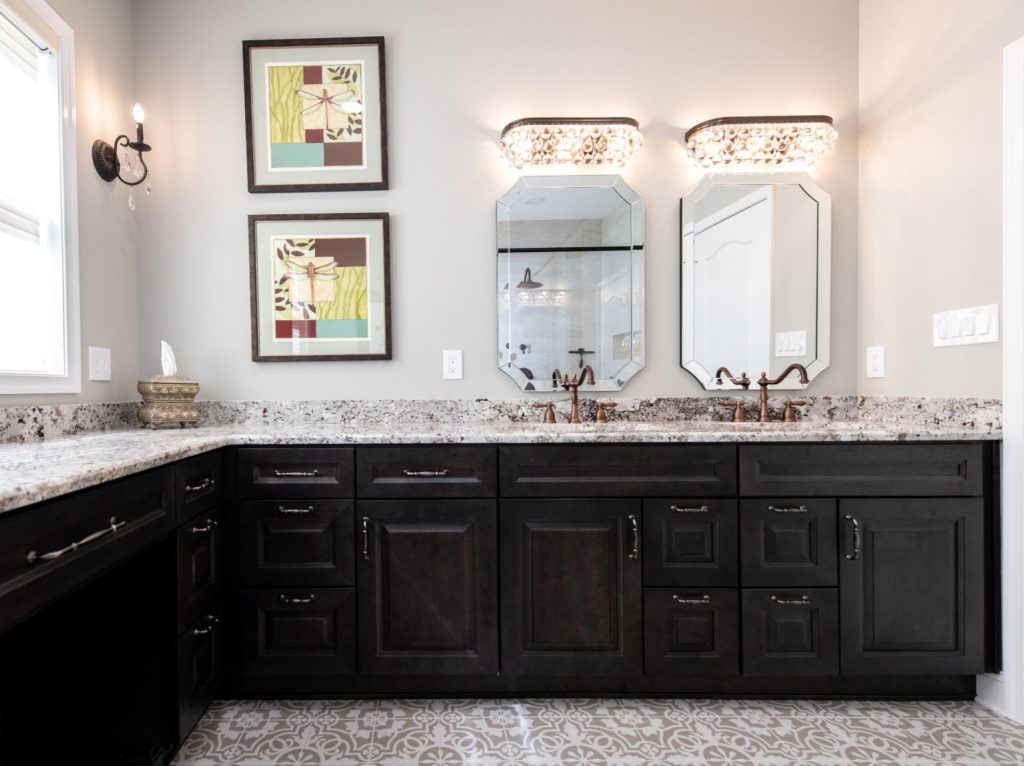 Large bathroom with black cabinets from amiano and son