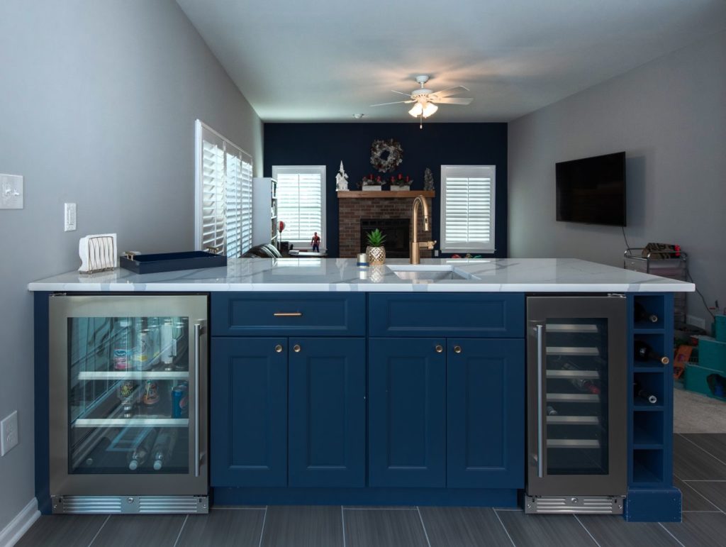 Renovated kitchen with blue cabinets and center island from Amiano and son