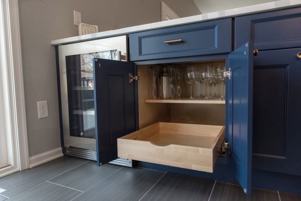 Renovated kitchen with blue cabinets and center island from Amiano and son