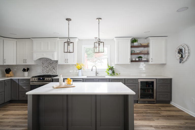renovated kitchen with gray cabinets and center island from amiano and son construction