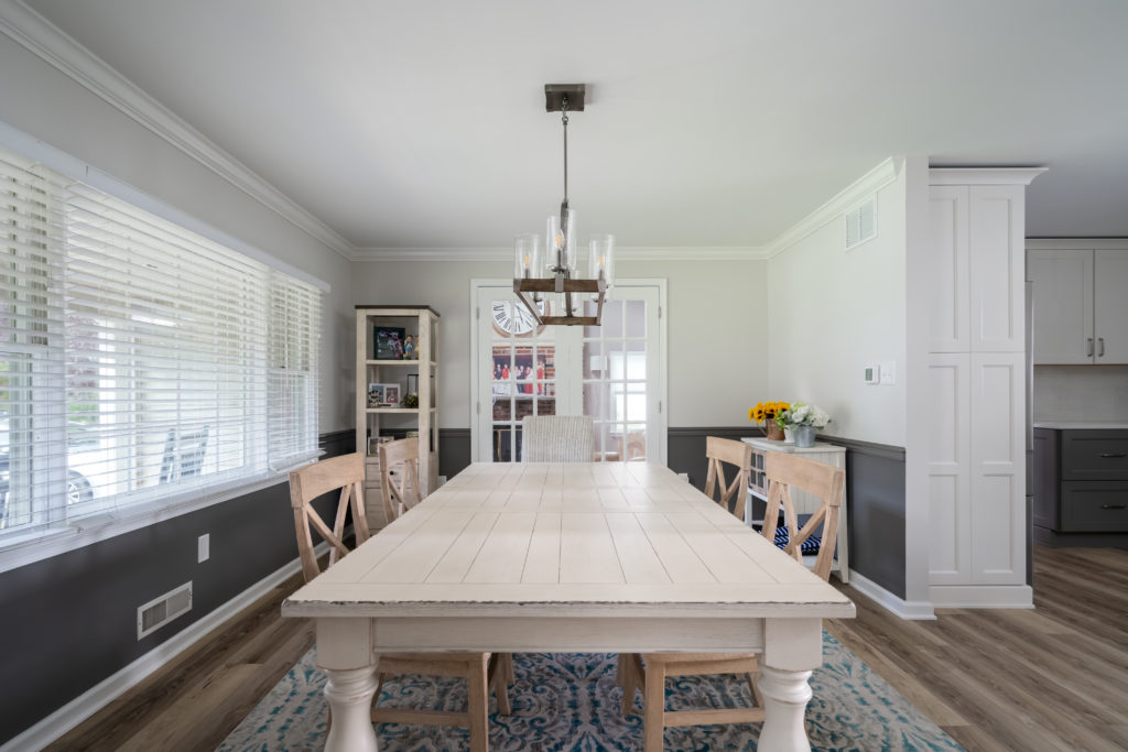 renovated dining room with chandelier from amiano and son construction