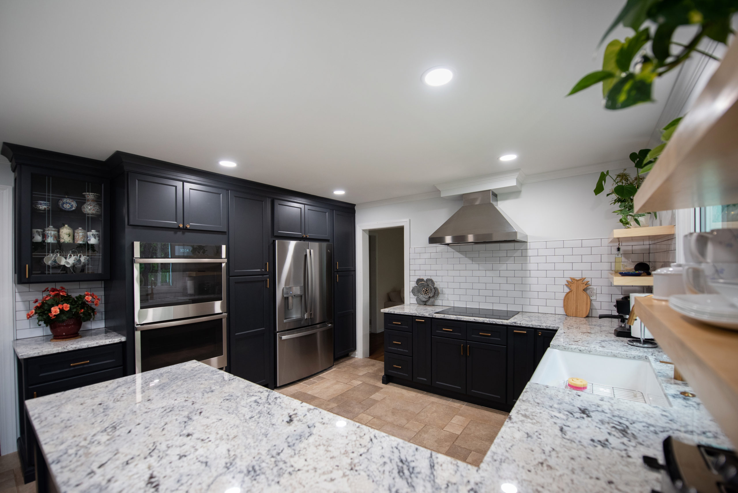 Kitchen With Granite Counters and Dark Cabniets