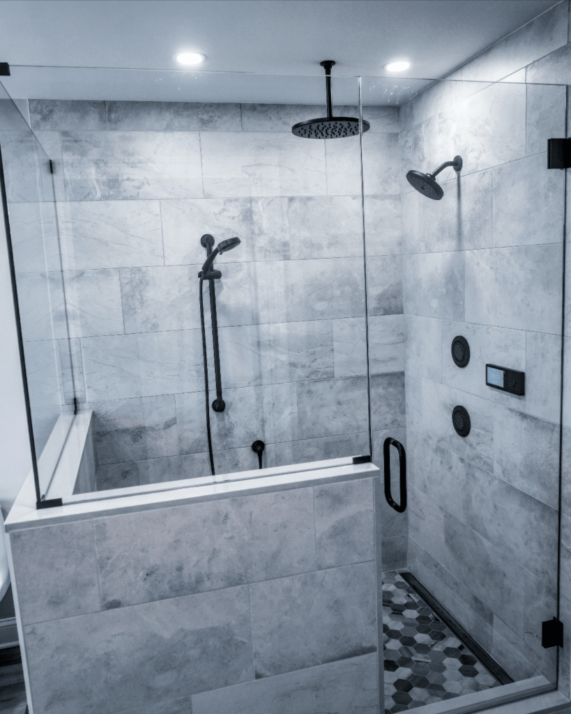 Glass door shower in a full bathroom remodel from amiano and son