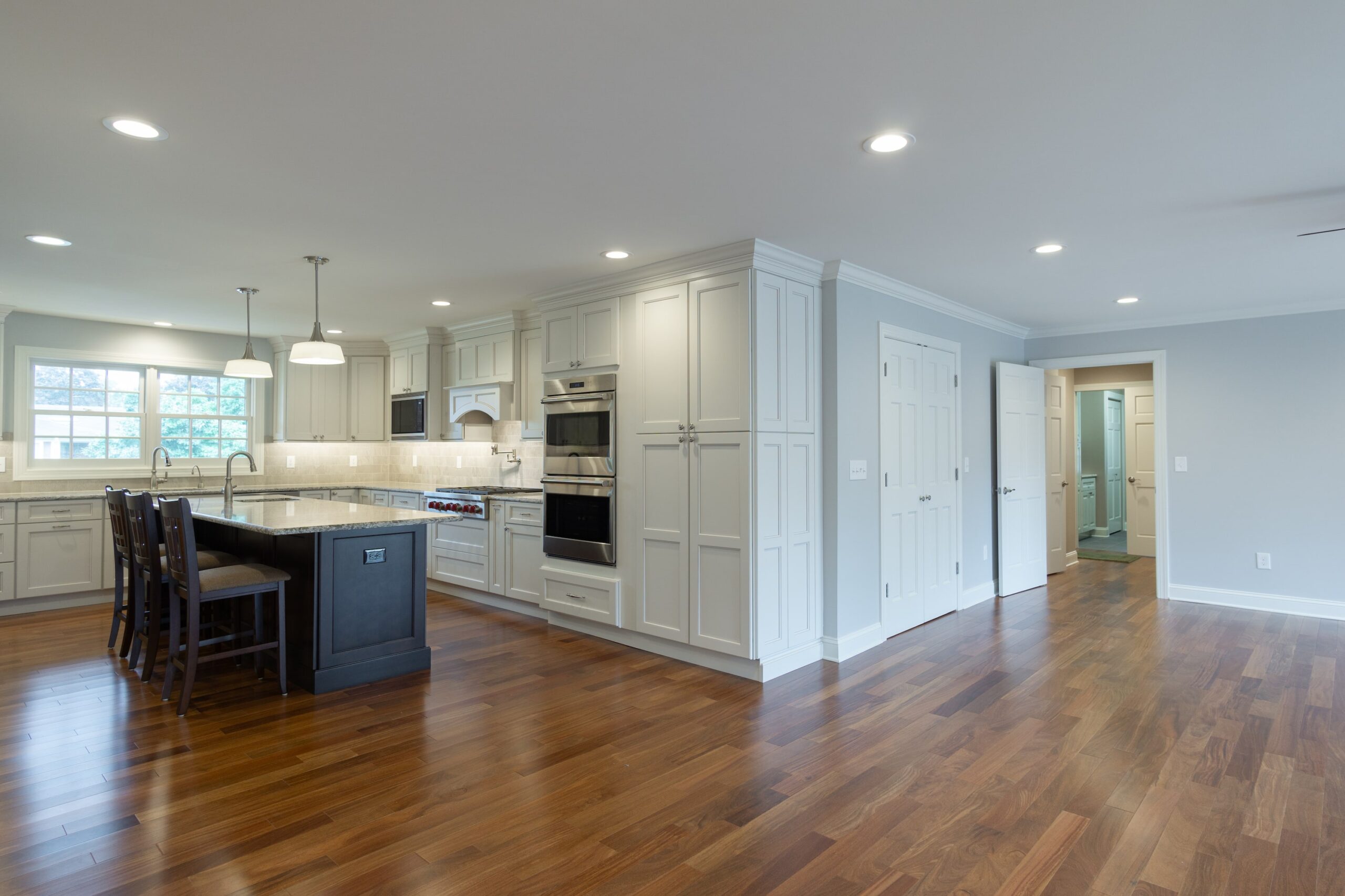 Kitchen with white cabinets and center island from amiano and son