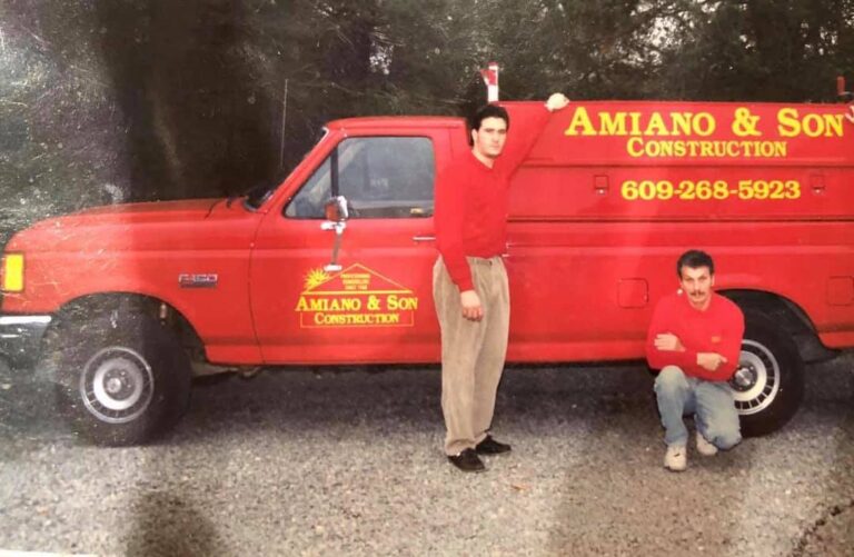 Amiano and son employees standing in front of their truck