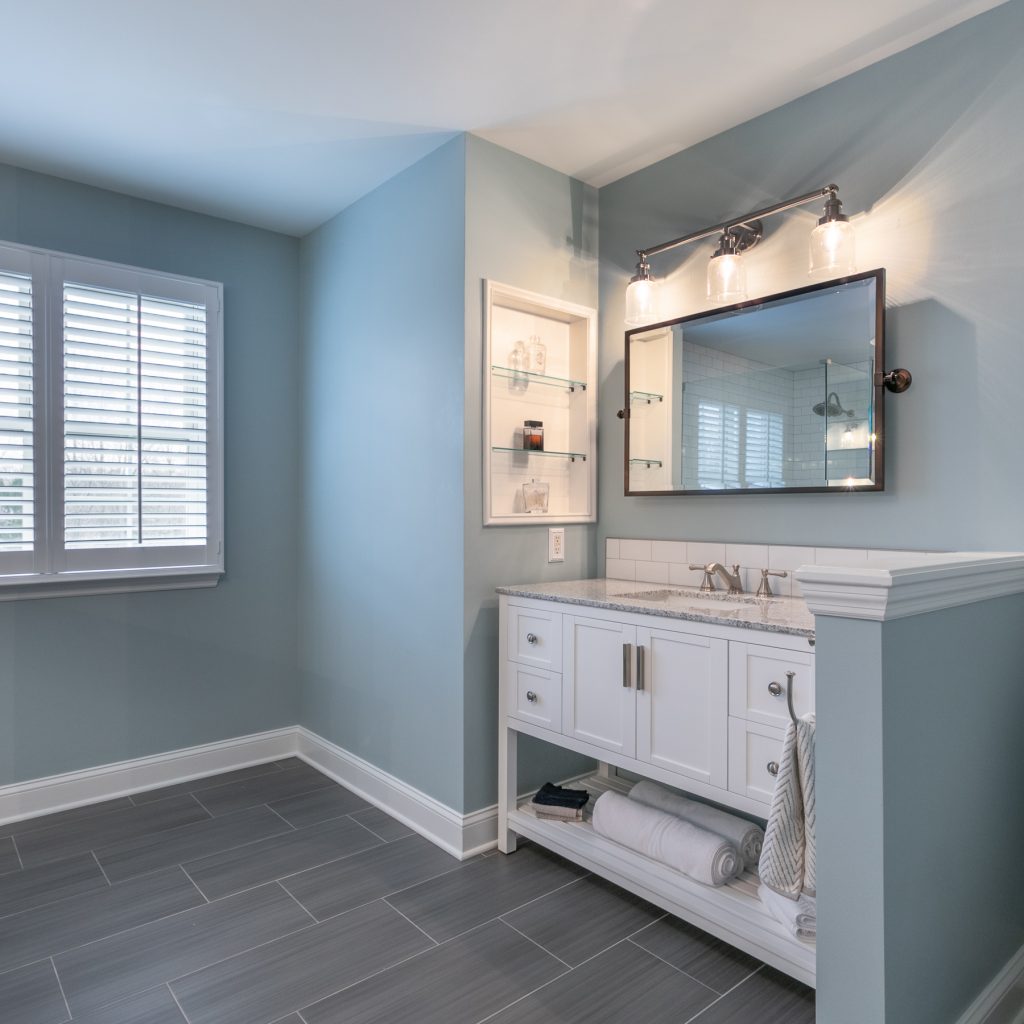 Large bathroom with blue walls from amiano and son